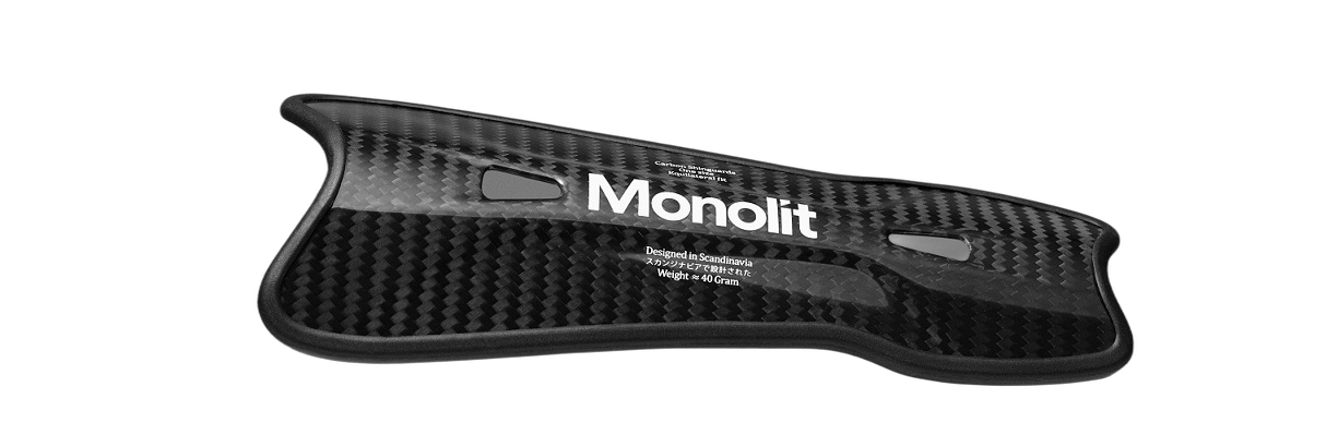 Carbon fiber shn guard with 'Monolit' branding on a white background